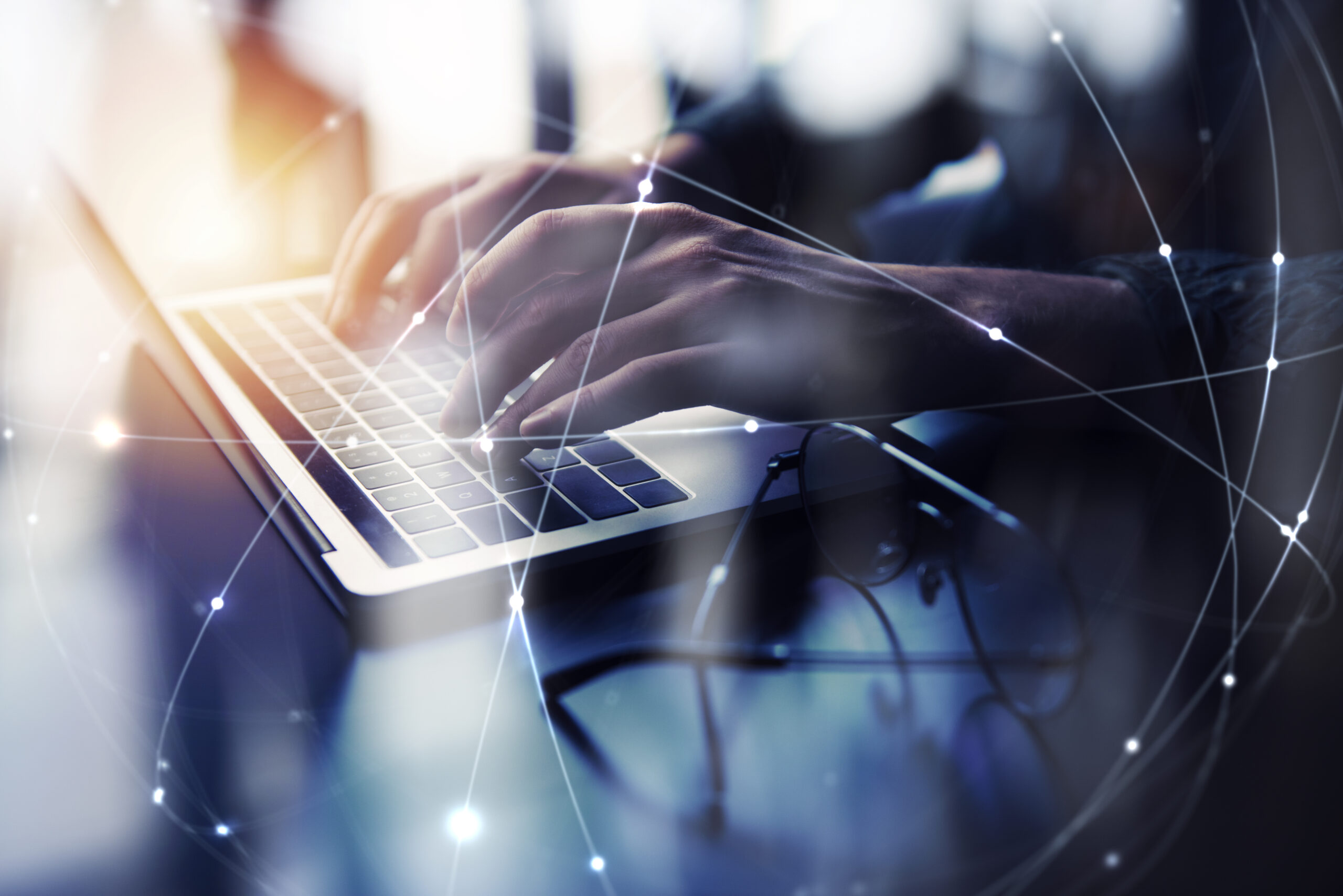Business man works in office with laptop. Concept of internet network. double exposure
