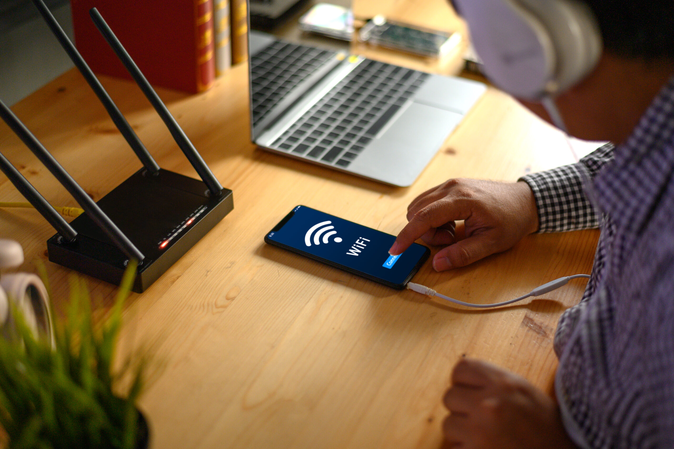Young man Connecting router wifi On smartphone for Internet and